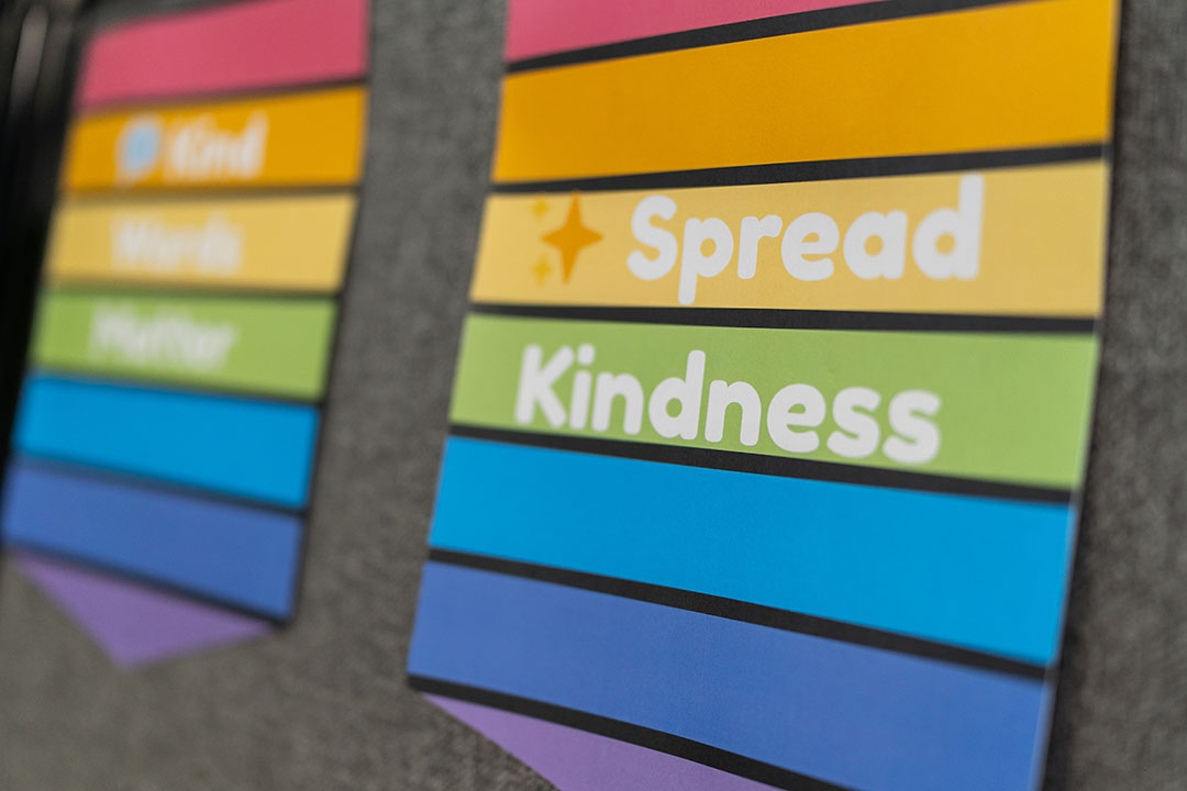 A classroom sign with the text Spread Kindness