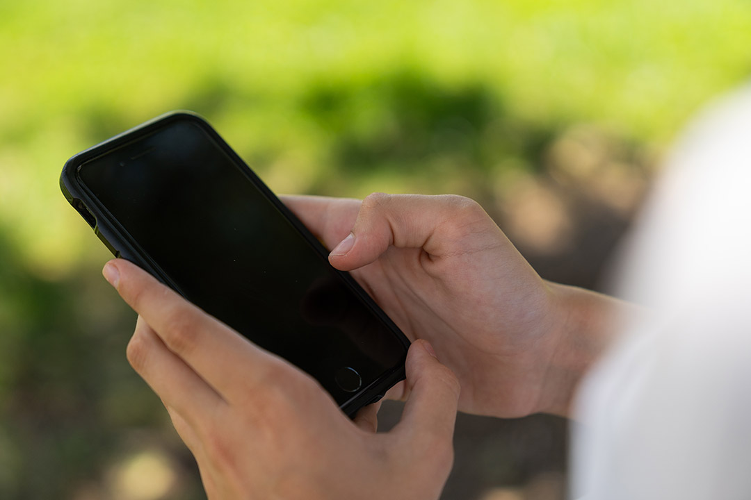 Hands holding a smartphone